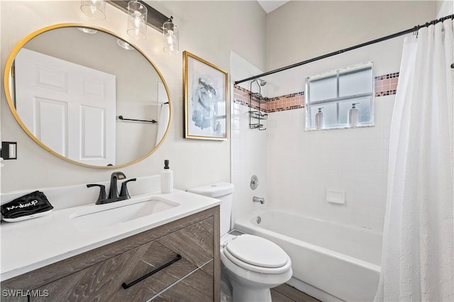 bathroom with shower / tub combo, vanity, and toilet