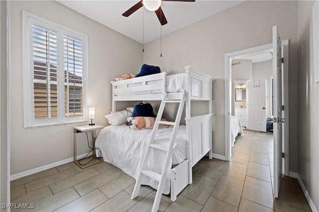 bedroom with baseboards and a ceiling fan