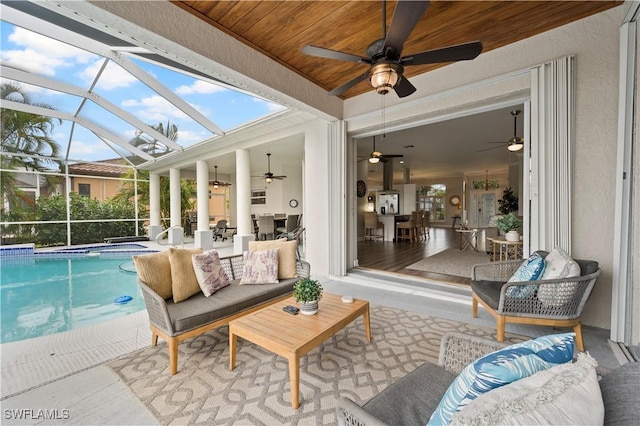 sunroom featuring lofted ceiling and wooden ceiling