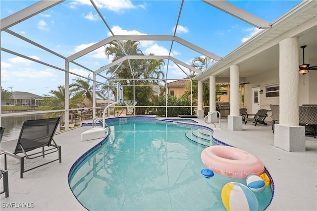 view of swimming pool featuring a patio, a lanai, ceiling fan, and an in ground hot tub