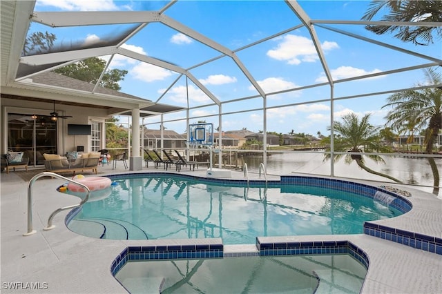 view of pool with a patio, glass enclosure, ceiling fan, an outdoor living space, and a pool with connected hot tub