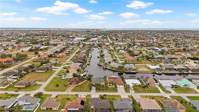 bird's eye view featuring a residential view and a water view