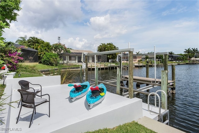 dock area featuring a water view and boat lift