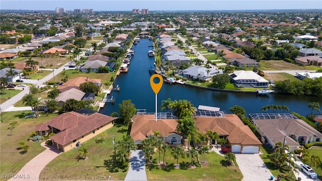 bird's eye view with a water view and a residential view