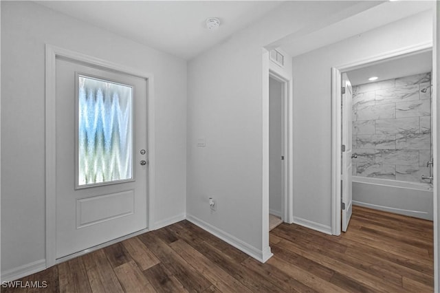 entryway with dark hardwood / wood-style flooring