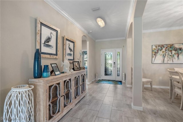 entrance foyer featuring ornamental molding