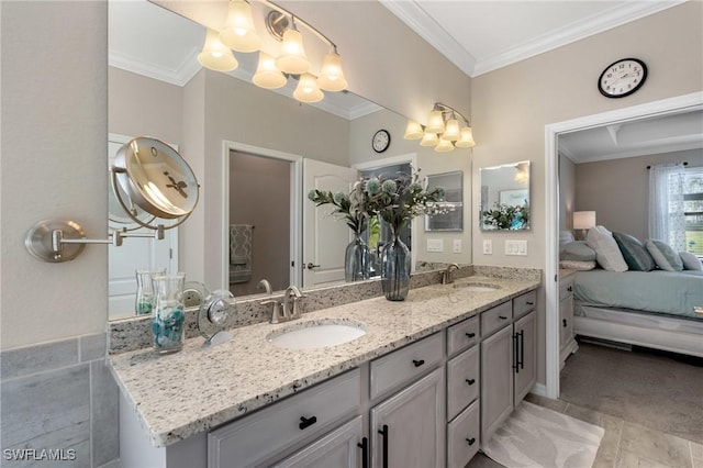 bathroom with vanity and ornamental molding