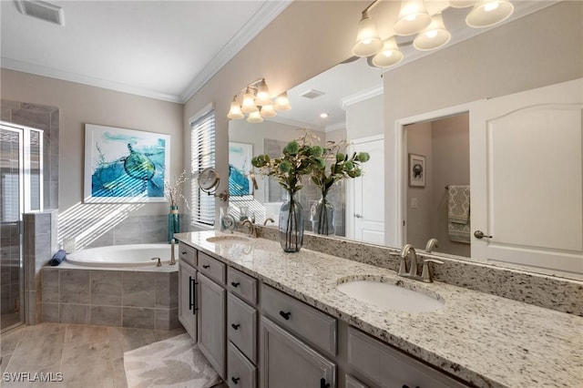 bathroom featuring independent shower and bath, crown molding, and vanity