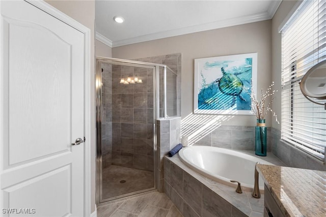 bathroom featuring ornamental molding and shower with separate bathtub