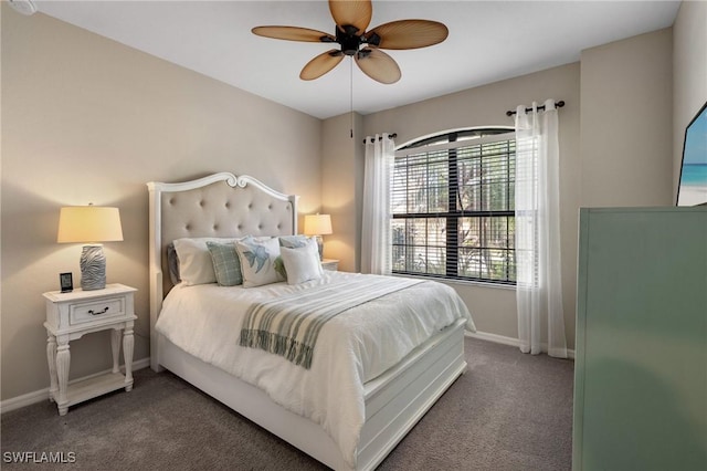 bedroom with ceiling fan and dark carpet