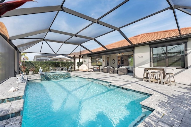 view of swimming pool with an outdoor living space, a patio area, an outdoor bar, and an in ground hot tub