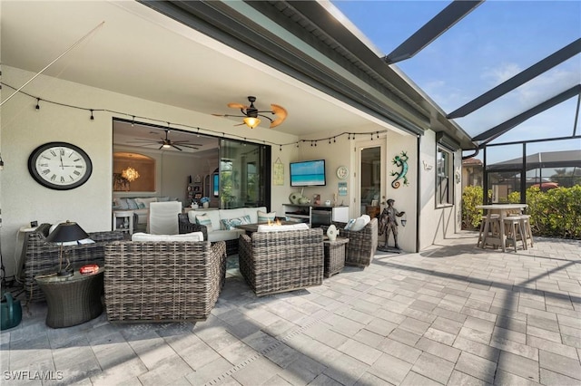 view of patio featuring an outdoor living space, a lanai, and ceiling fan