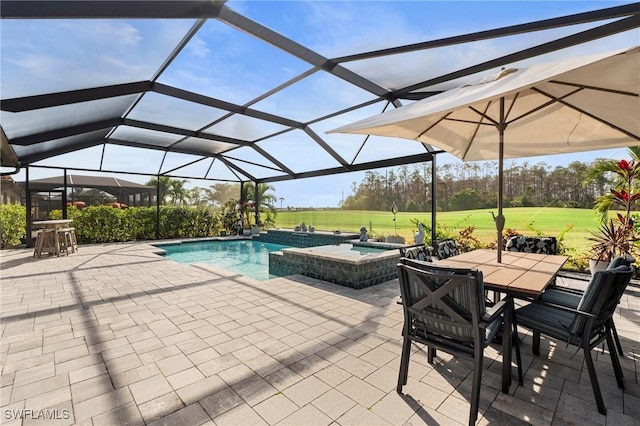 view of pool featuring an in ground hot tub, a patio area, and glass enclosure