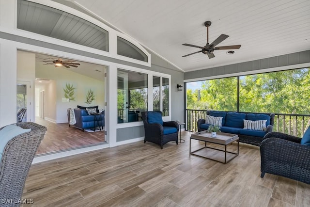 sunroom featuring ceiling fan and lofted ceiling