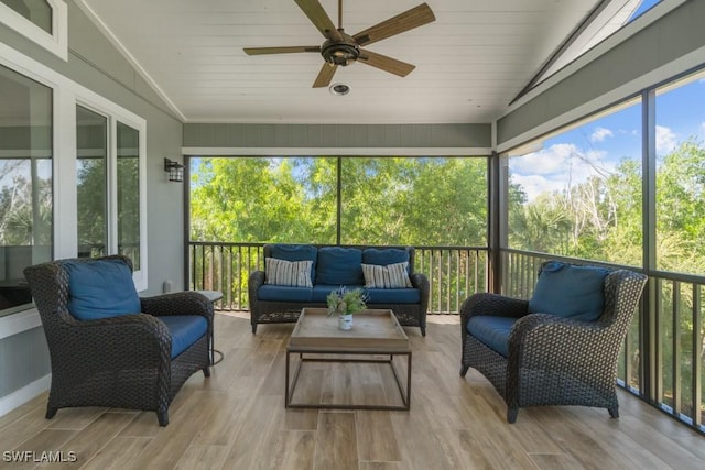 sunroom / solarium with vaulted ceiling and ceiling fan