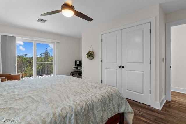 bedroom with access to exterior, a closet, dark hardwood / wood-style floors, and ceiling fan