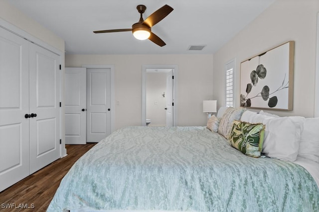 bedroom with dark wood-type flooring and ceiling fan