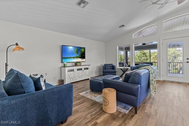 living room featuring dark hardwood / wood-style floors and ceiling fan