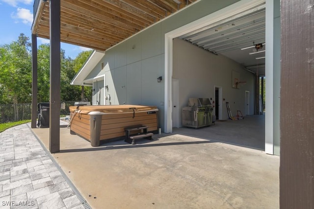 view of patio with a hot tub