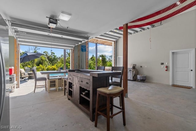 view of patio / terrace with a bar and a swimming pool