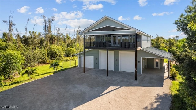 back of house featuring a garage