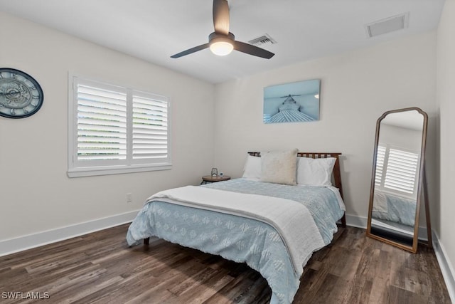 bedroom featuring dark hardwood / wood-style flooring and ceiling fan