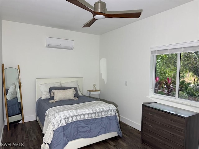 bedroom with a wall unit AC, dark hardwood / wood-style floors, and ceiling fan