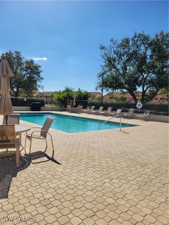 view of swimming pool featuring a patio