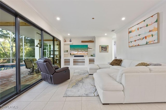 tiled living room with built in shelves and ornamental molding