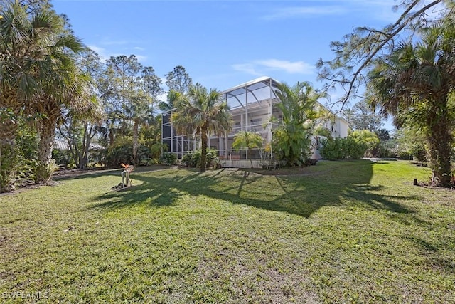 view of yard featuring a lanai