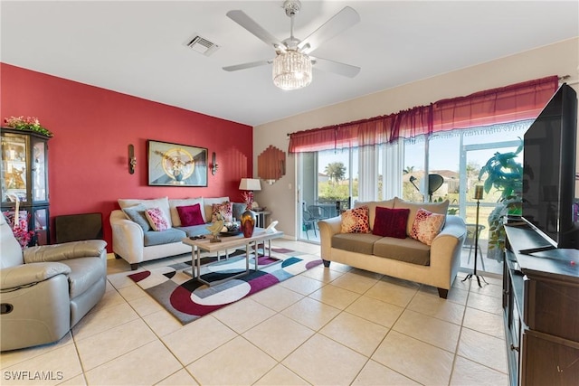 tiled living room featuring ceiling fan