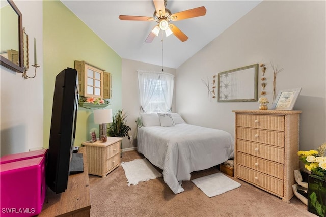 carpeted bedroom featuring ceiling fan and lofted ceiling