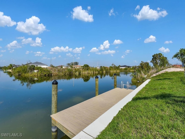 dock area featuring a yard and a water view