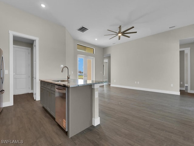 kitchen featuring open floor plan, visible vents, dishwasher, and a sink