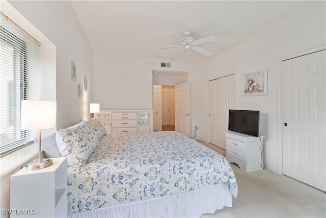 carpeted bedroom featuring ceiling fan