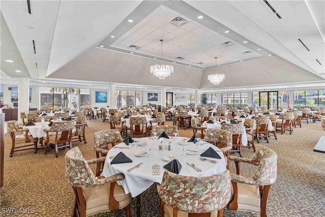 carpeted dining area featuring a raised ceiling, high vaulted ceiling, and a notable chandelier