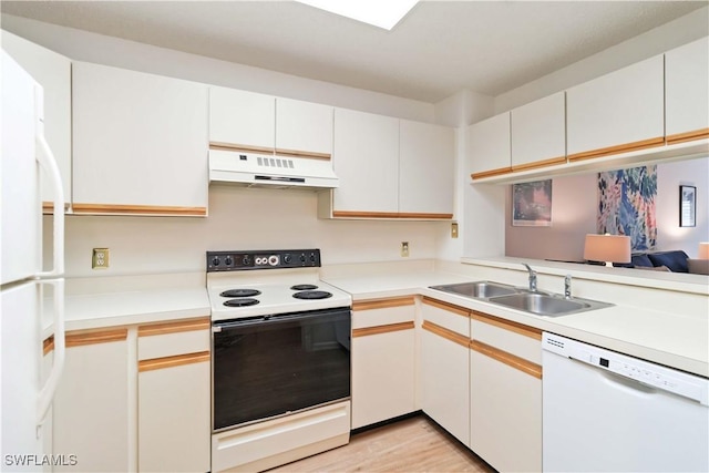 kitchen with sink, white cabinets, and white appliances