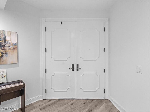 foyer entrance with light hardwood / wood-style flooring