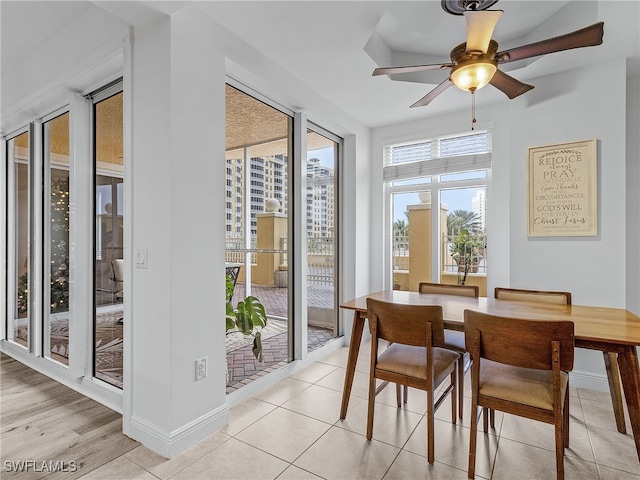 dining room with light tile patterned floors and ceiling fan