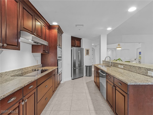 kitchen with stainless steel appliances, light stone countertops, sink, and light tile patterned floors