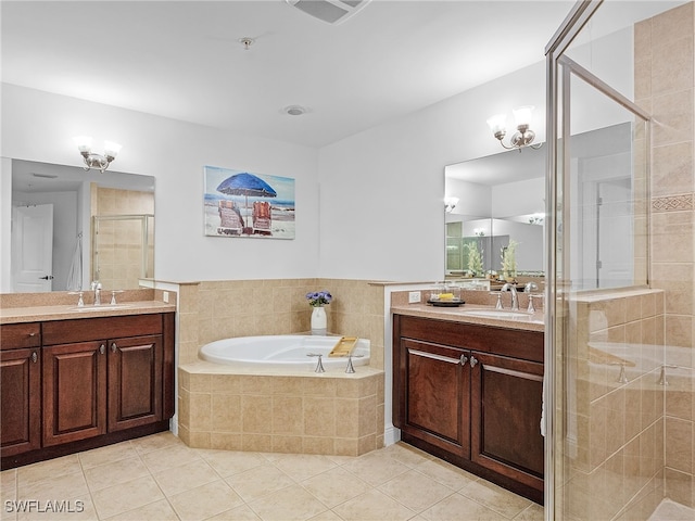 bathroom with shower with separate bathtub, tile patterned floors, and vanity