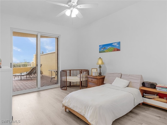 bedroom featuring wood-type flooring, access to exterior, and ceiling fan