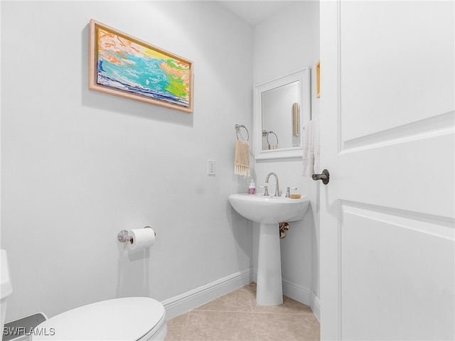 bathroom featuring tile patterned floors and toilet