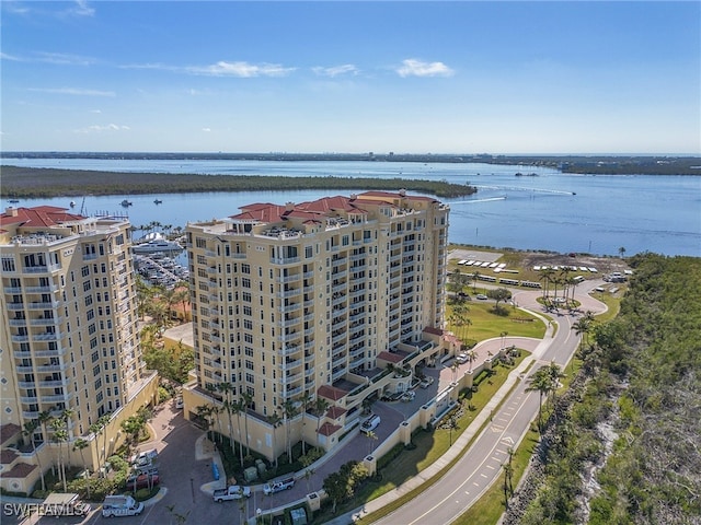 birds eye view of property with a water view