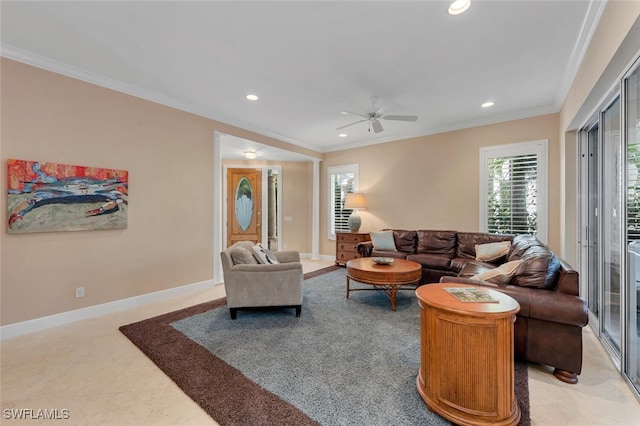 living room with ornamental molding, light tile patterned floors, and ceiling fan