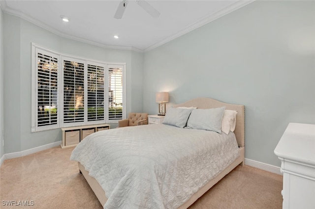 carpeted bedroom featuring crown molding and ceiling fan