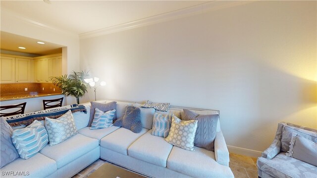 living area with recessed lighting, baseboards, light tile patterned flooring, and crown molding