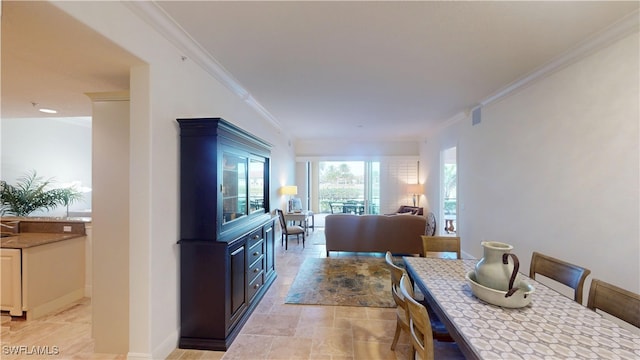 dining space featuring crown molding, visible vents, and baseboards