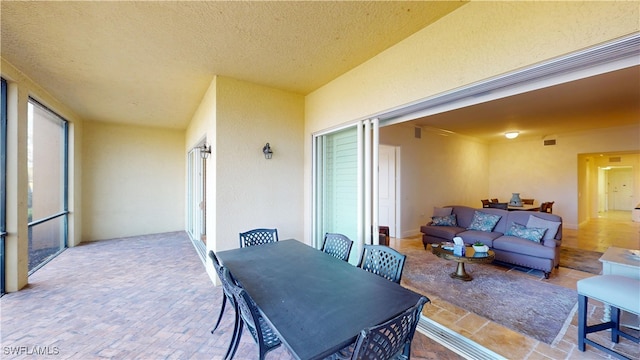 view of patio with outdoor dining space and an outdoor hangout area