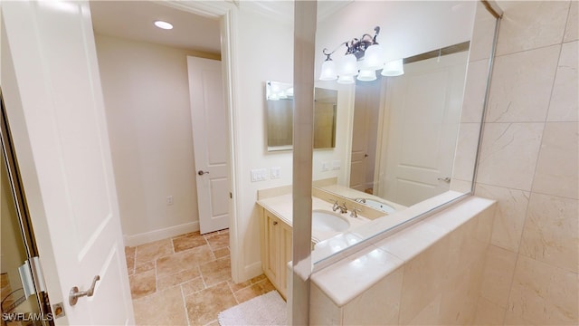 full bath with recessed lighting, baseboards, stone tile floors, and vanity